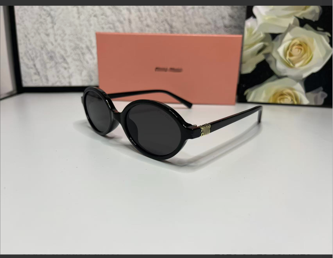Miu Miu Style Oval Sunglasses — Black